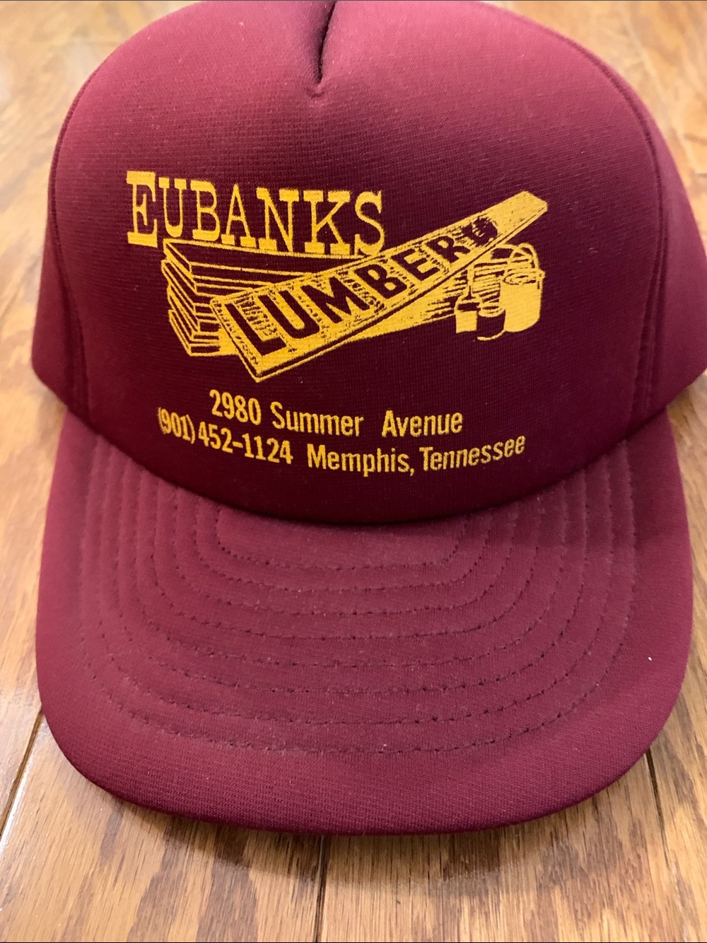Eubanks Lumber Maroon Trucker Hat with Yellow Logo